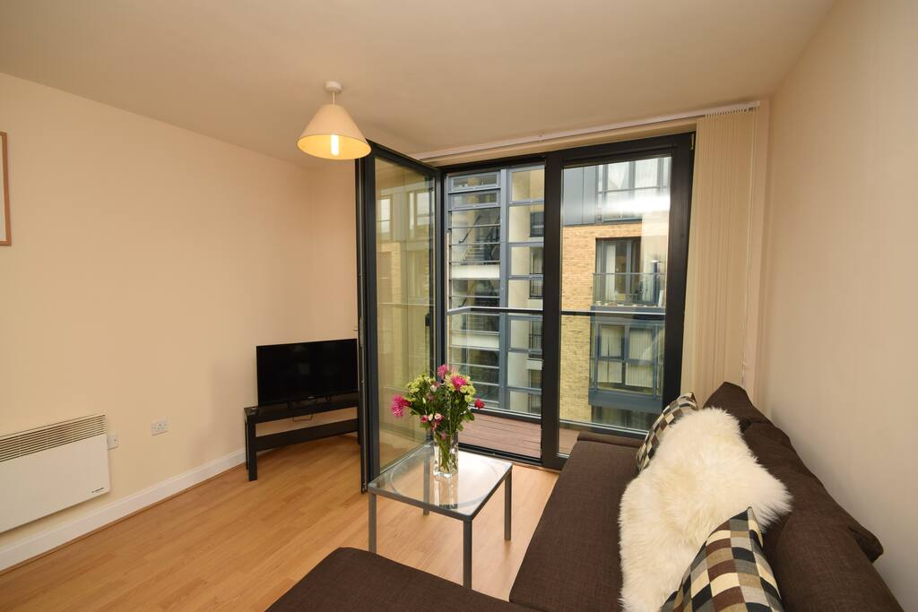 Lounge area with door access to the balcony.