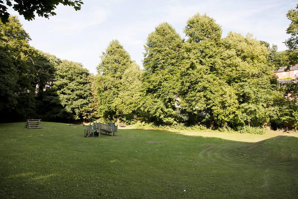 The Paddock has a wooden play area. There is a cut through from the road.