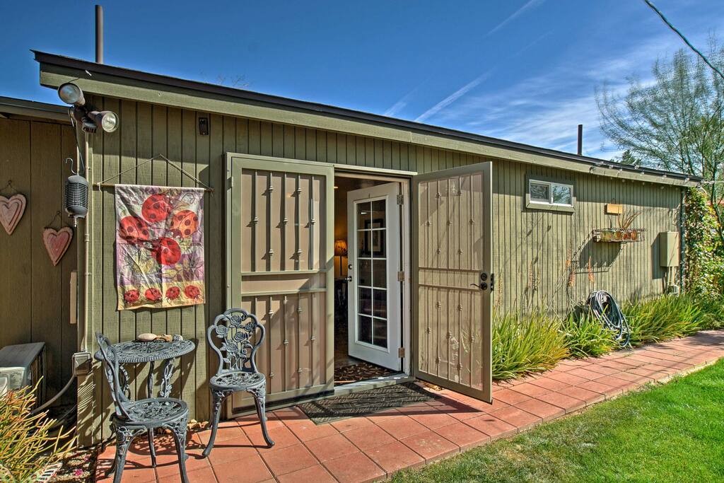 This remodeled guest house features a comfortable living space and private backyard oasis.