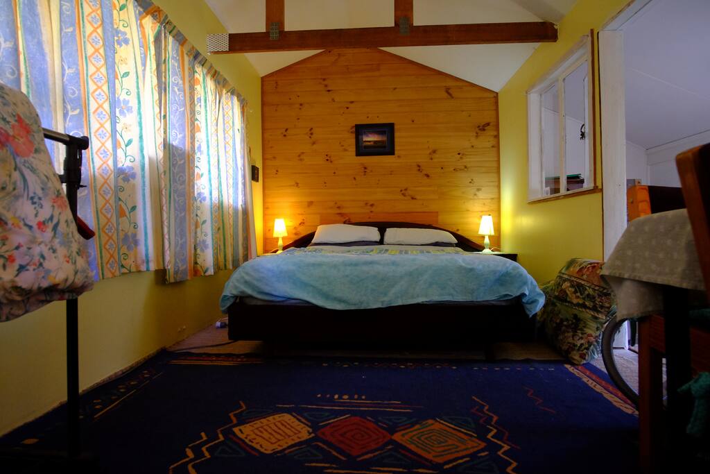 The comfortable real bed has a bedhead and base of Sri Lankan teak, with matching side tables. The mattress is comfortably supported by 9 broad 4" (100mm) slats. There are also 2 x 2 drawer side units.
Installed Sept 2016.