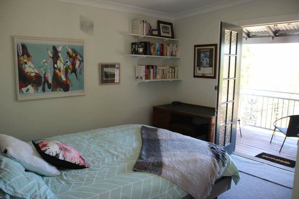 View of bedroom looking on to veranda