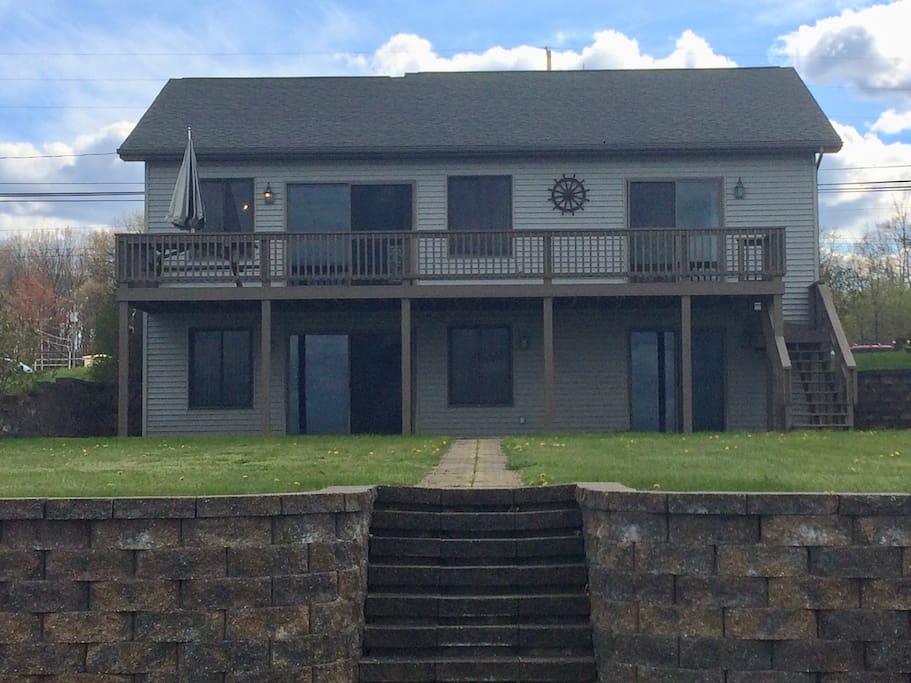 Exterior of house, with large windows providing lake views from all lake facing rooms