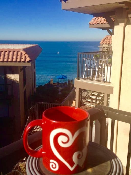 Enjoy the beautiful ocean view while drinking a cup of coffee from the balcony off the living room