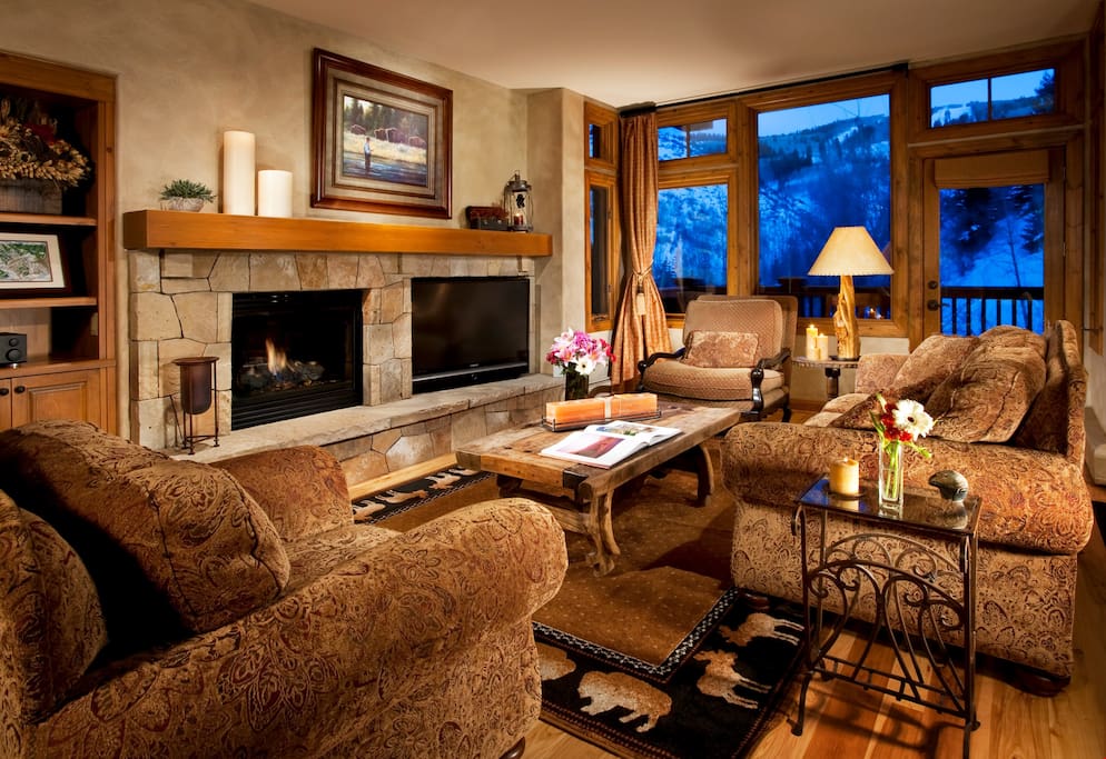 Relax in the luxurious living area, complete with fireplace