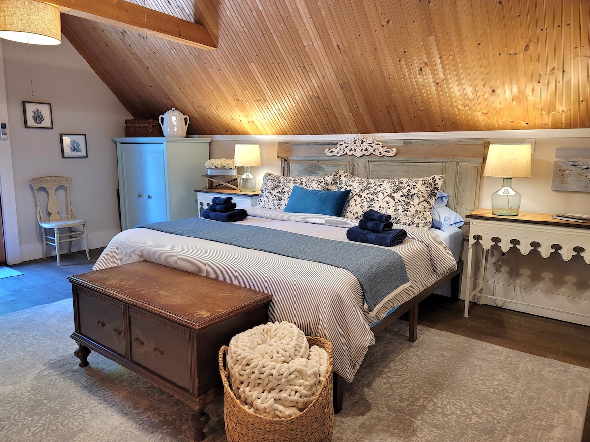 Loft king bedroom with a very comfortable king bed and pillows, and soft cotton linens.