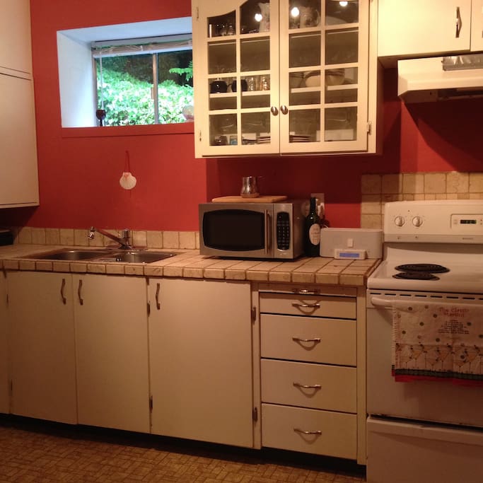Stove, microwave and full-size fridge/freezer.