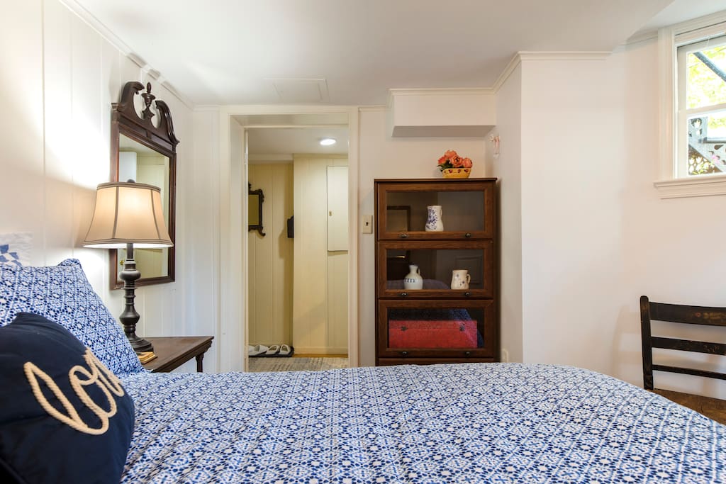 Bedroom, looking toward doorway and apartment entryway