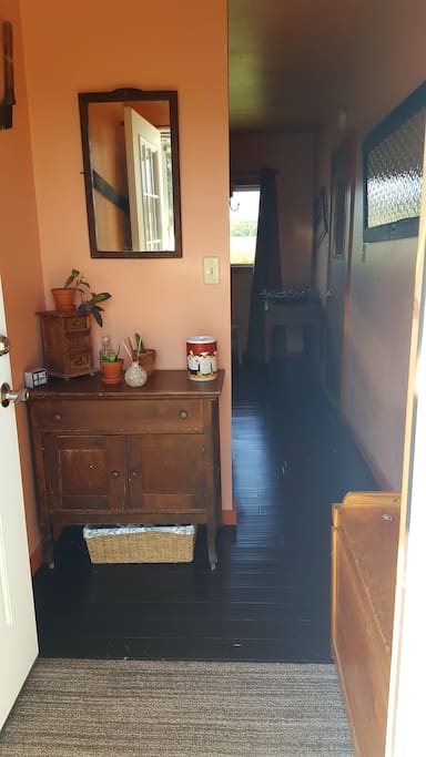 Walking through the front door.