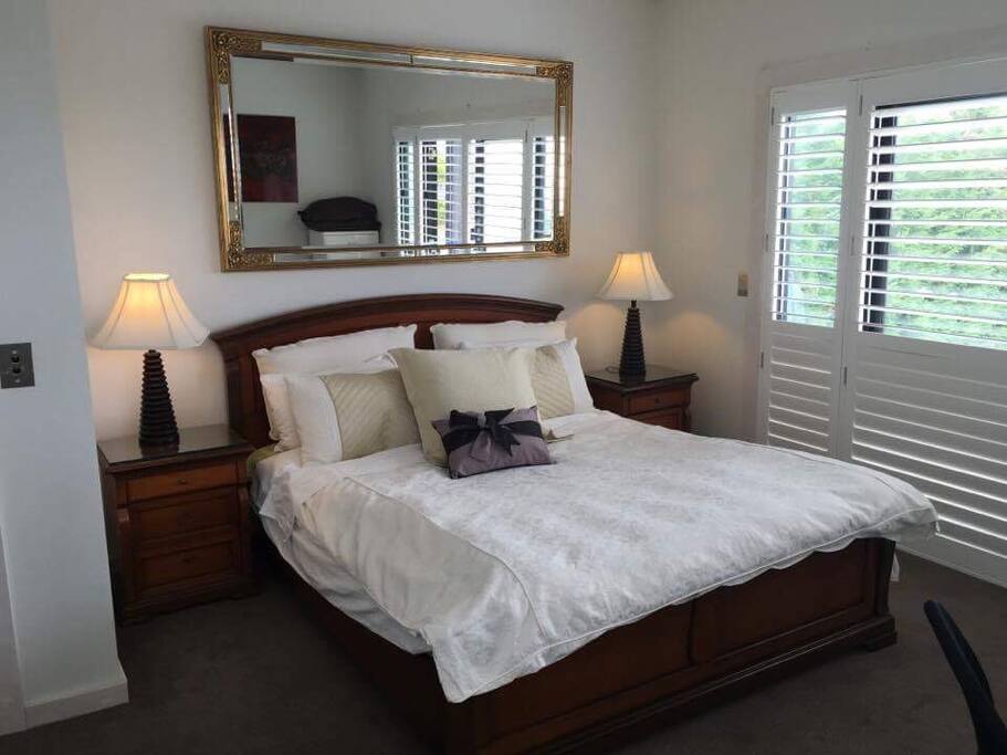 Room opens to balcony overlooking rear yard/pool