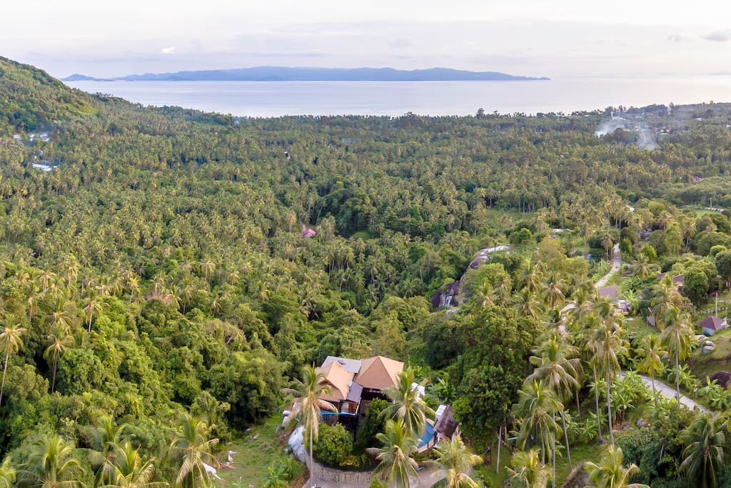 The villa view from the sky facing the jungle with a panoramic 360 view on the sea and Koh Samui.