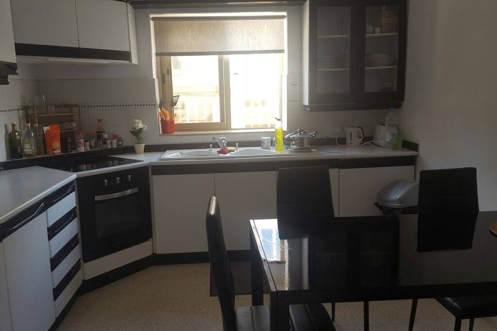 Modern kitchen with all appliances needed.