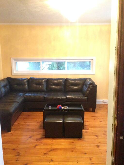 Very comfortable living room to relax in. A fifth person can easily sleep on this very comfortable sectional.