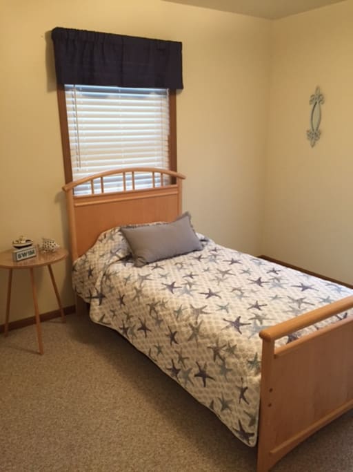 First floor bedroom with twin bed and another twin trundle bed