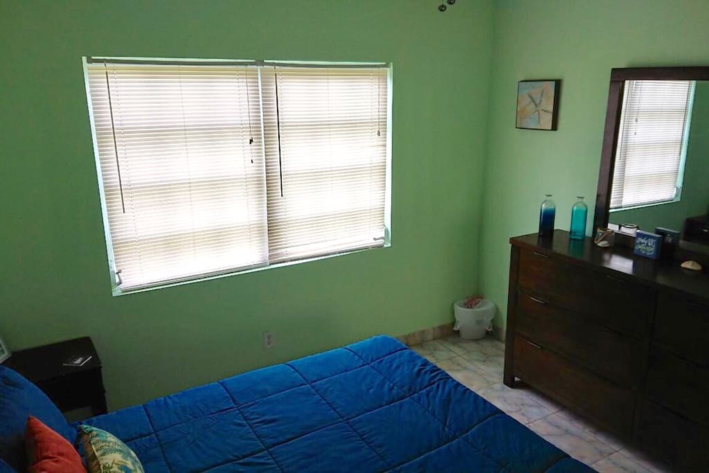 Bedroom 1. Queen sized bed with plenty of dresser space.