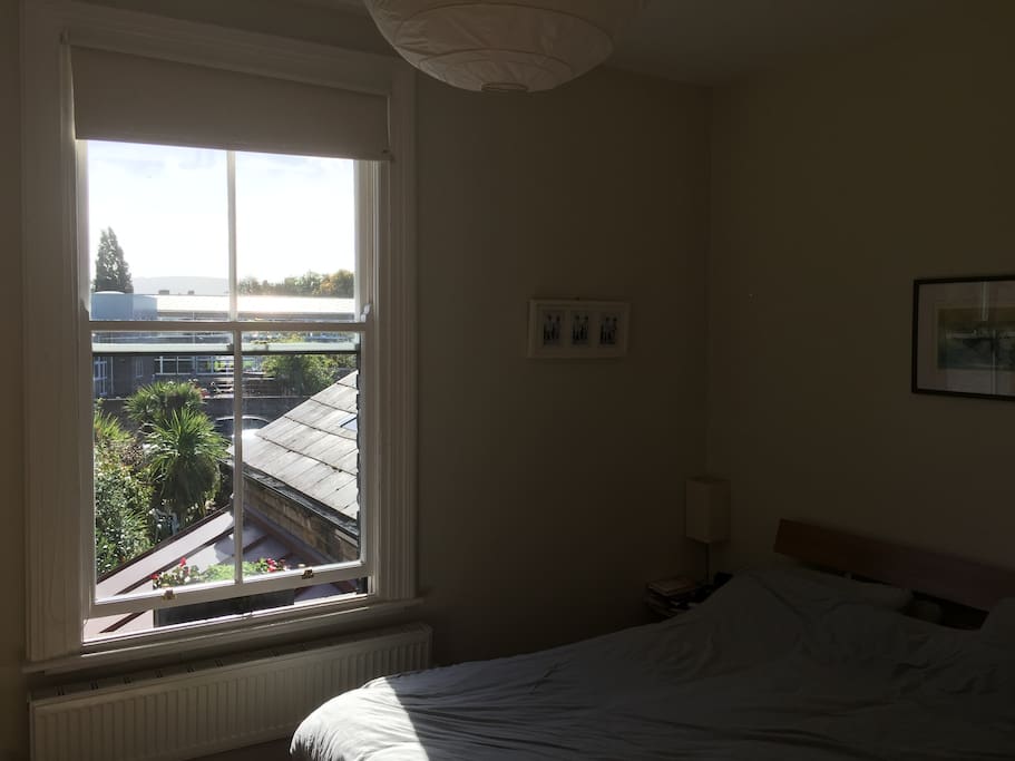 Upstairs Bedroom 1. Double bed with memory foam mattress topper. Super quiet and bright with views of the Dublin Mountains. Newly insulated and reglazed windows means quiet and warm.
