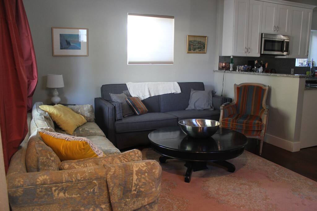 Comfortable living room with seating for everyone. Couch folds out to queen for extra sleeping
