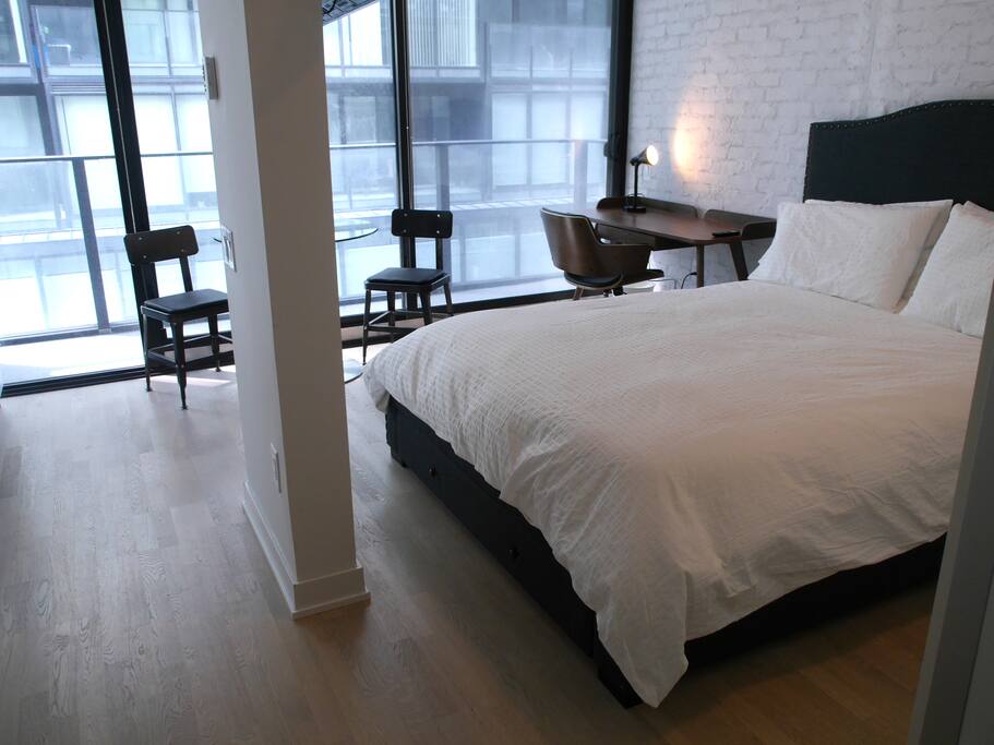Bright unit with high ceilings and hardwood floors throughout