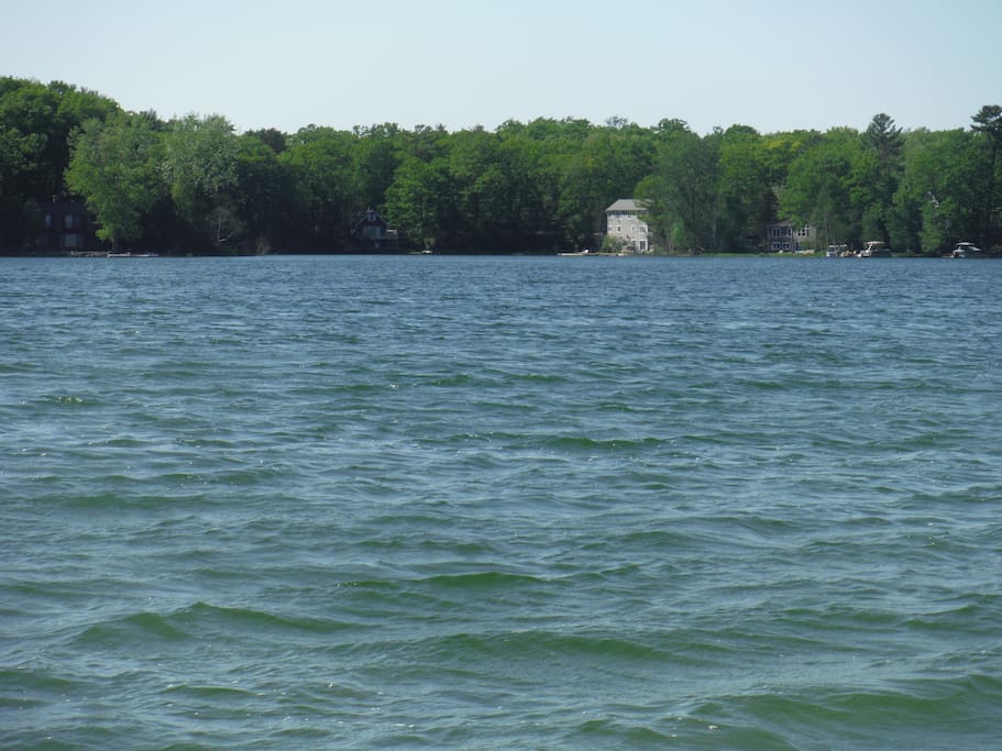 Main body of lake house in back ground.
