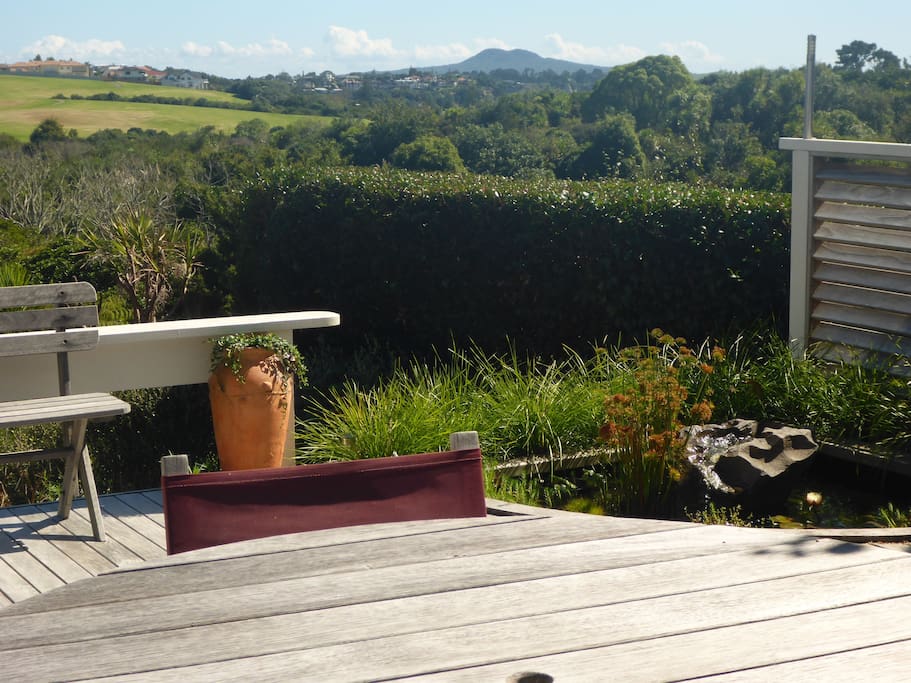 Enjoy the private deck with unobstructed views of native trees, sea and Rangitoto island.