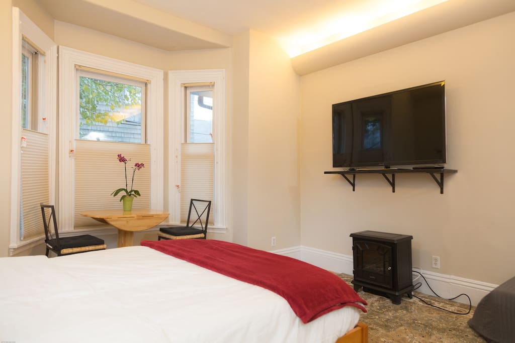 Living area with bed, tv and reading area