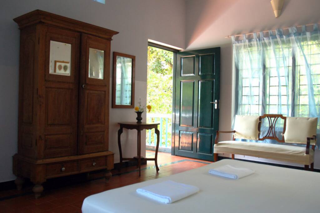 spacious room with king size bed, comfortably and stylishly decorated