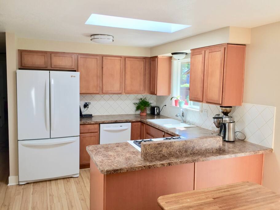 Kitchen with Gas Range, Dishwasher, and Giant Fridge