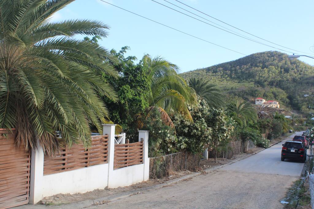 Viewed from the patio of the studio. Shows ample parking space and the beautiful hills of Antigua in the background.