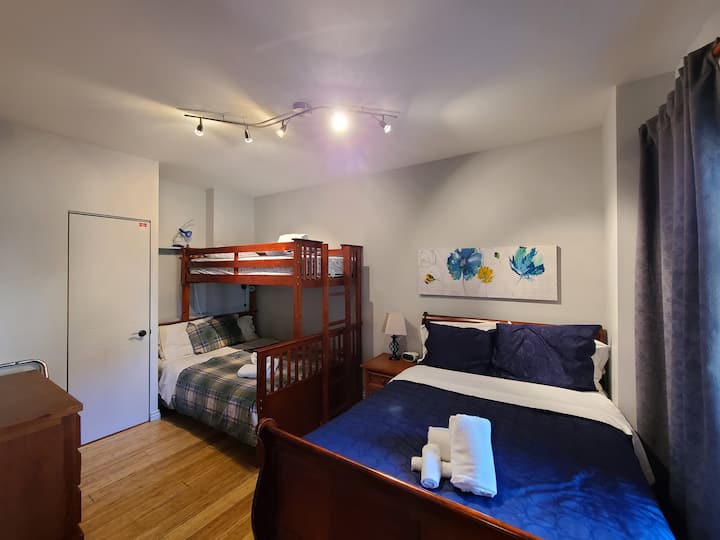 2nd bedroom with two double beds and single bunk bed