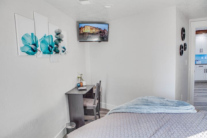 Second downstairs bedroom also features a desk and 32" Vizio smart tv.