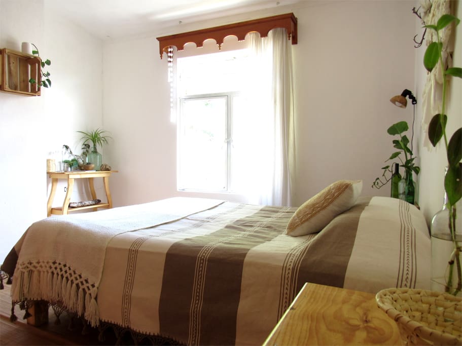 The queen sized bed at the bedroom