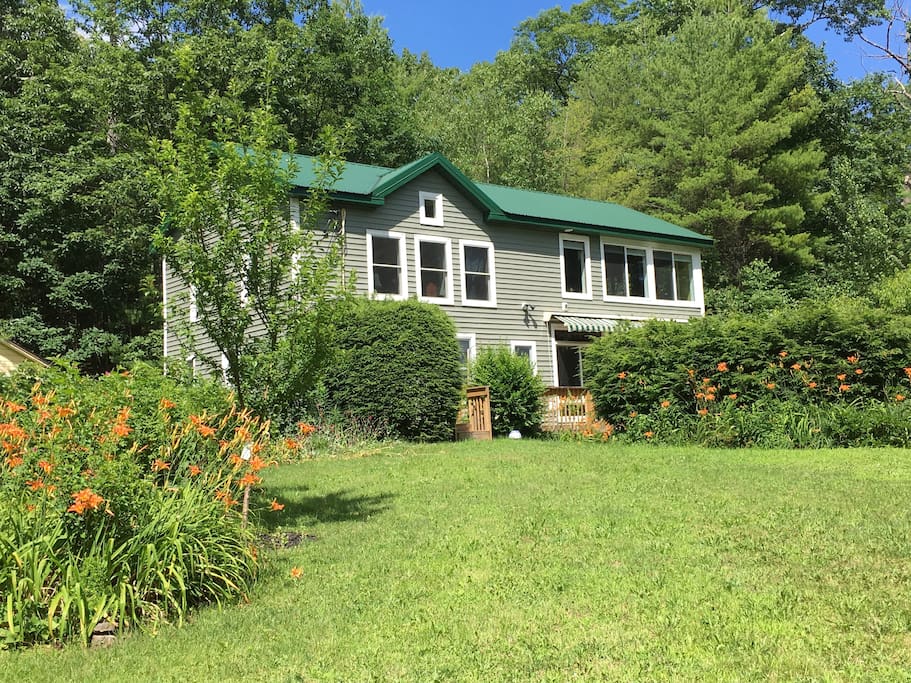 Our house with the second floor wall of windows overlooking the Catskill mountains