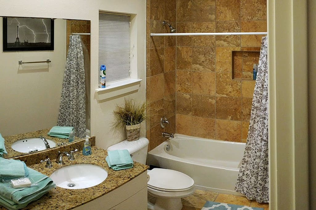Upscale bathroom- always clean with fresh towels and washcloths. A new bar of soap and shared shampoo/conditioner are provided.