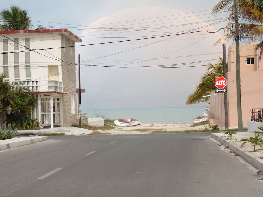 Out the front door, turn right. The beach is right there