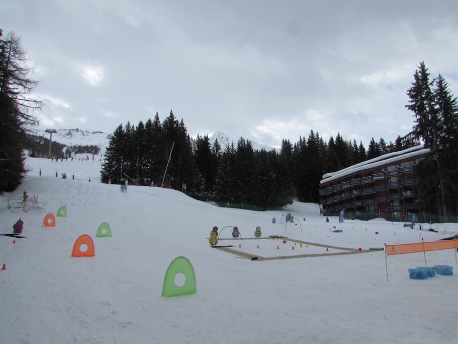 View from the kids ski school to the apartment on the right and slopes above