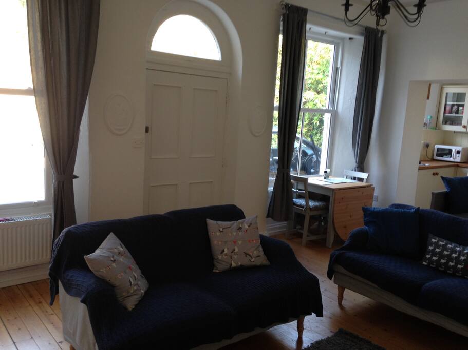 Spacious living room and dining area with oil central heating, and TV with built in DVD player