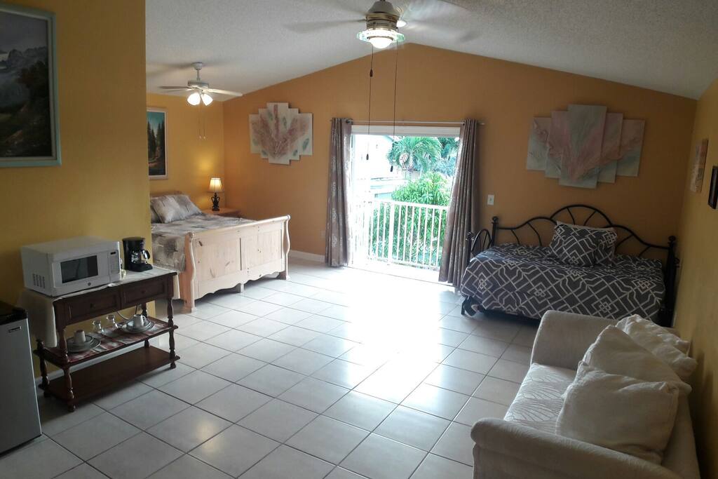 Enjoy your stay at this extra large Master Suite w/ private balcony and pool access. It is perfectly-sized for a couple, young family, or group of friends and is equipped with essential amenities, WiFi, refrigerator, microwave and coffee maker.