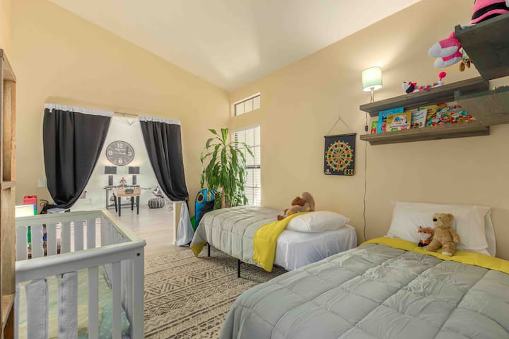 Bedroom #5 has play area, two twin beds and a full size crib. Please note, there is no door, but blackout out curtains for privacy . Pack&play is available as well 