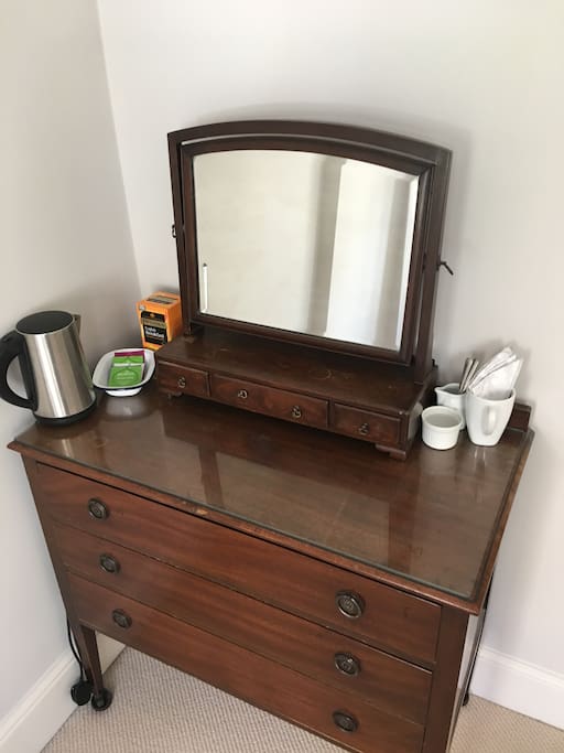 A kettle is provided, with both herbal teas and English breakfast tea. Milk is available on request from the fridge in the kitchen and a small jug is provided.