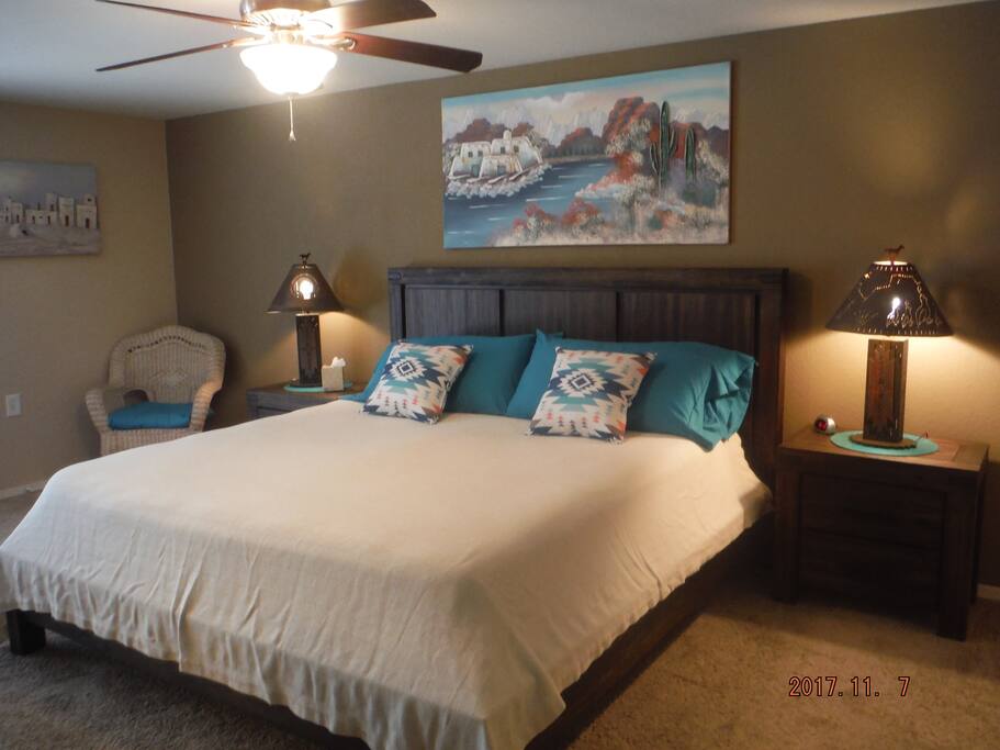 Master bedroom has a king size bed