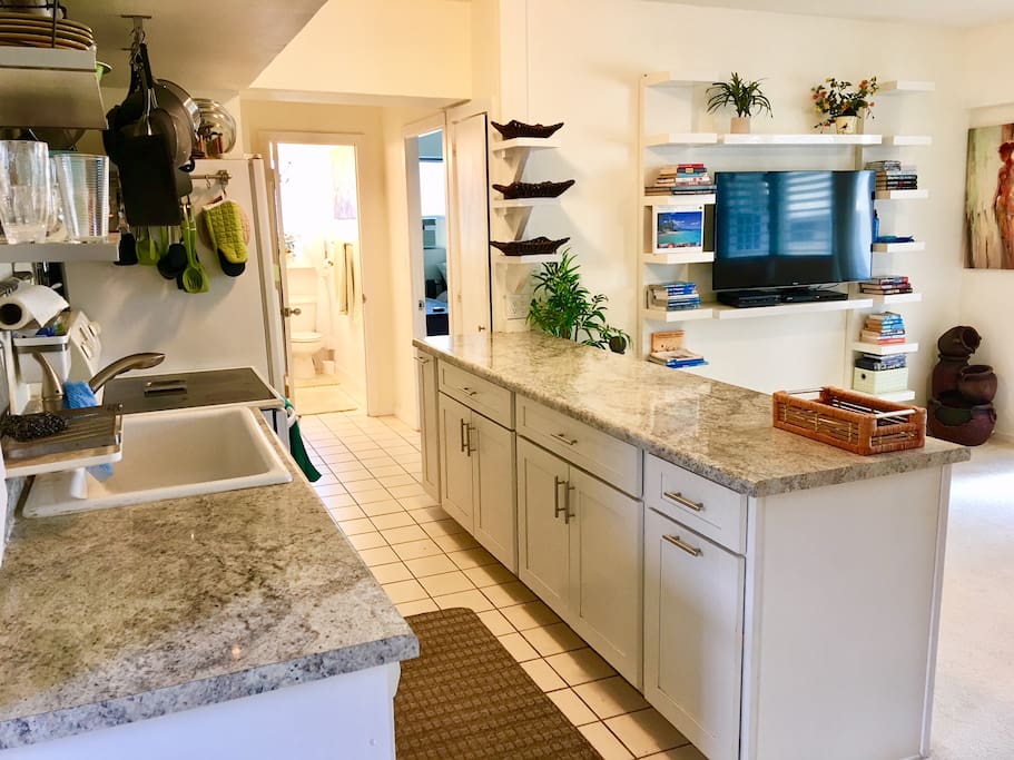 Spacious kitchen and 50 inch flat screen TV with DVD. TV can pull out and turn in any direction. Watch your favorite show while cooking!