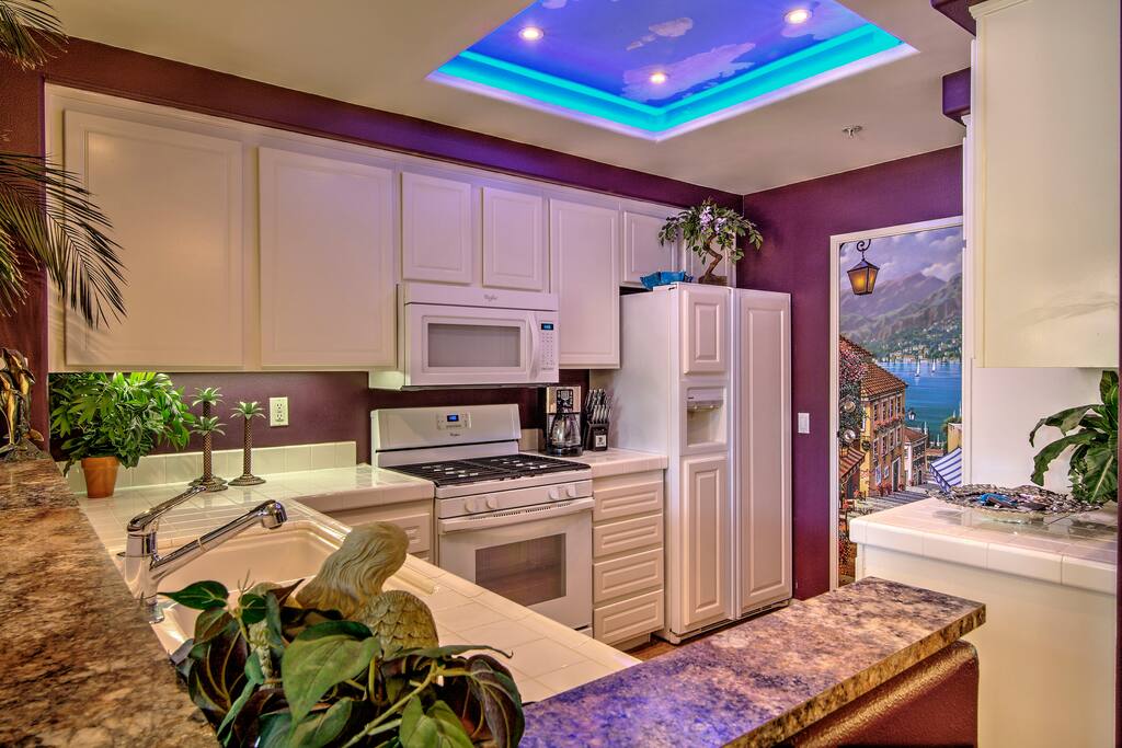The kitchen bar features granite counter tops.