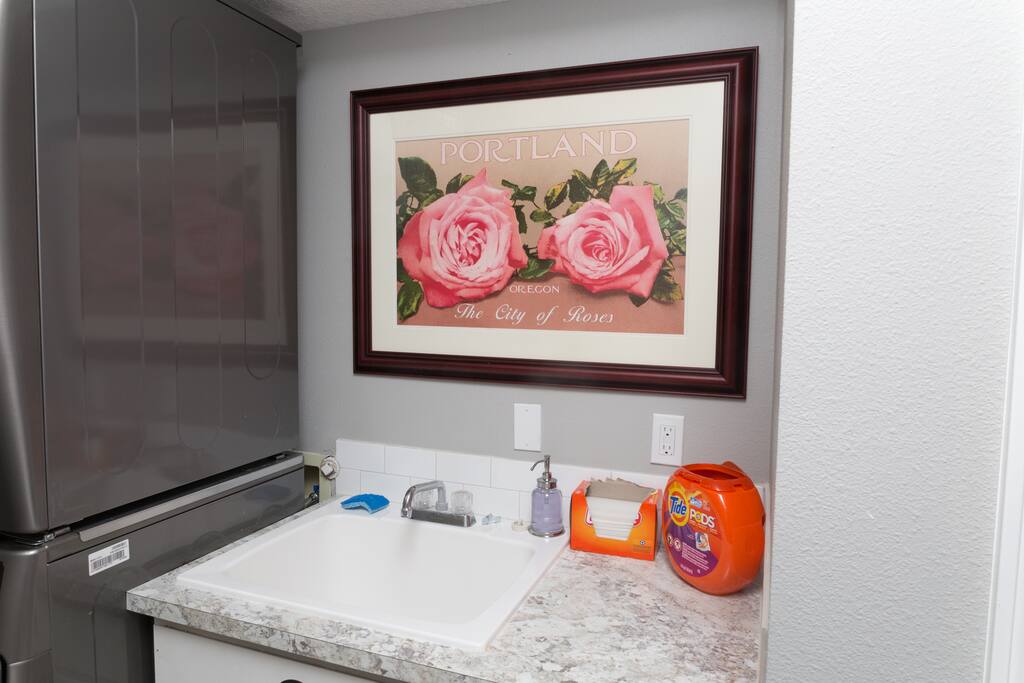 laundry room with double washer and dryer