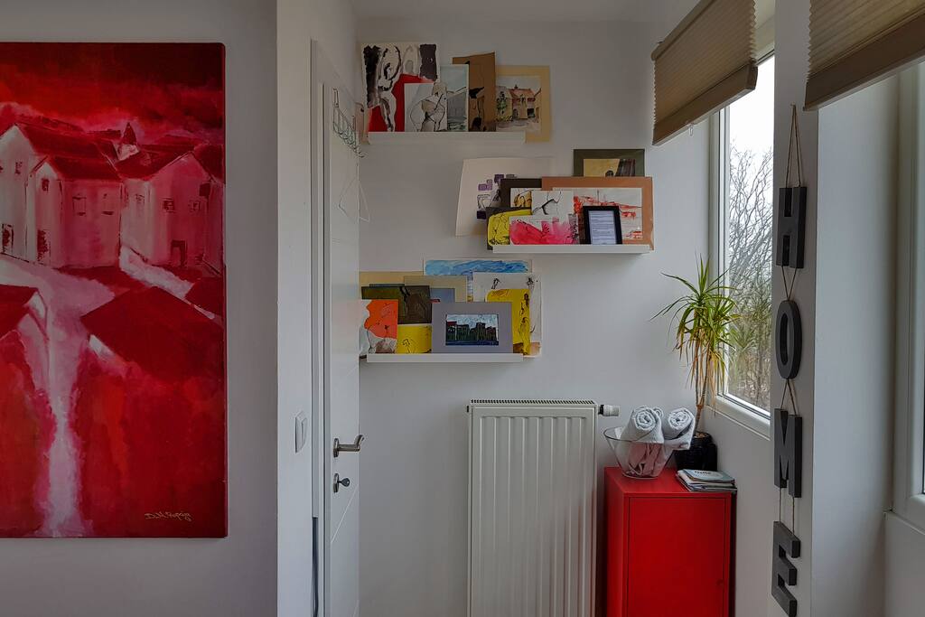 Room entrance area with some of the local artwork displayed.