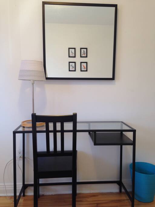 Working area with computer desk, mirror and lamp