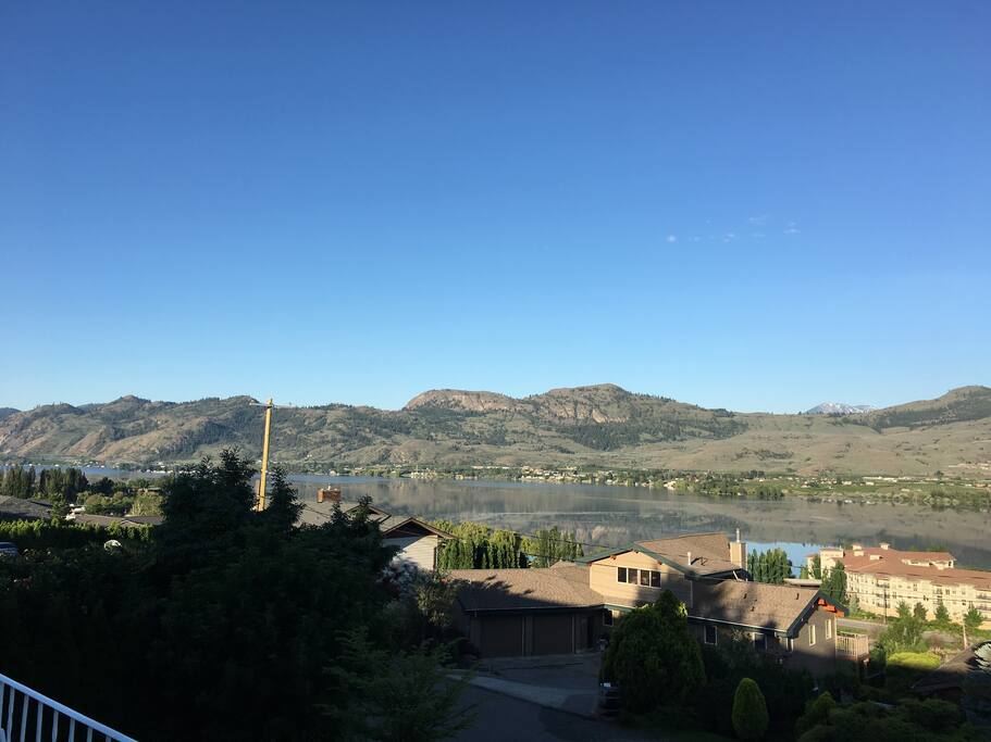 View of lake and surrounding mountains, also reflections of mountains in lake, SW view