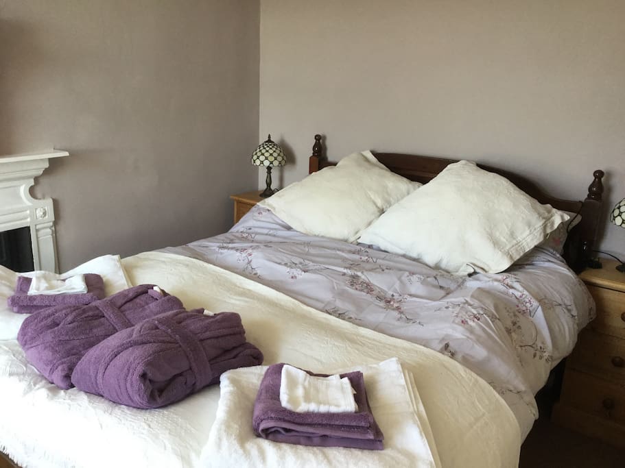 Lavender bedroom with comfy bathrobes