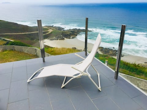 Arnela Beach House with a garden and terrace