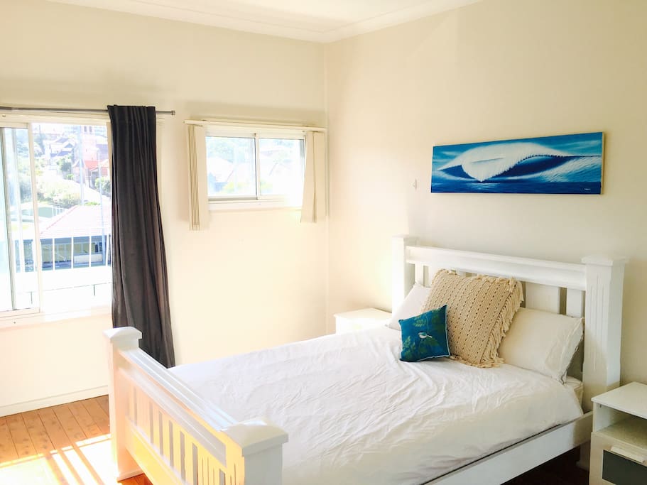 Large bedrooms with mirrored wardrobes and wooden floors