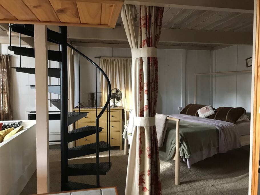 Lower bedroom heavy curtains close to offer privacy from the rest of the place and shade from morning sunlight.