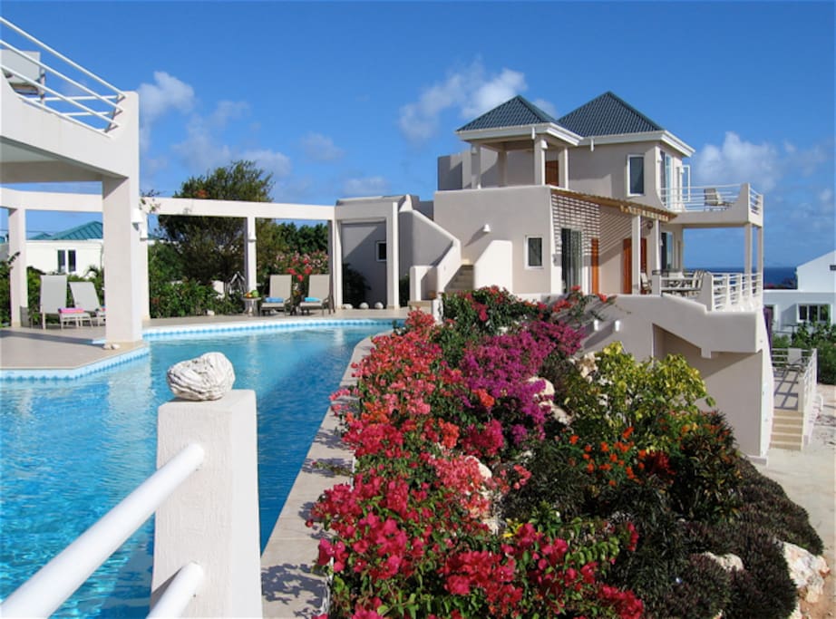 Relax and enjoy the colorful flower garden by the pool